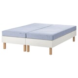 The ESPEVÄR/VADSÖ mattress set. It two light blue mattresses and a white base with wooden legs.