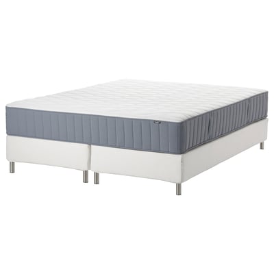 White and blue bed mattress with white base, nikea brand.