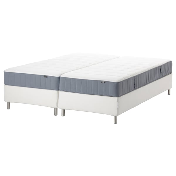 Two white mattresses on a white base, blue edges.