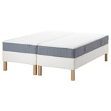 An ESPEVÄR/VESTERÖY bed in white with a blue-gray mattress, featuring wooden legs and a pocket sprung design.