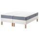 Option: White espevär bed with blue-gray mattress and stretch fabric top.