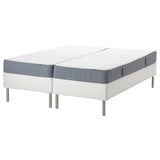 Two white split mattresses on a white and gray base with metal legs, ideal for adjustable sleeping surfaces.