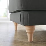 Dark gray ESSEBODA footstool with wooden legs on a wooden floor.