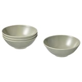 Five light green stoneware bowls, four stacked and one separate, simple modern design.
