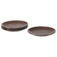 Stack of four rust-colored stoneware plates, simple design for versatile use.