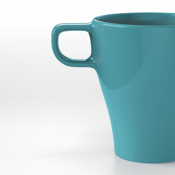 Turquoise mug with sturdy handle, smooth surface, and simple design, ideal for any setting.