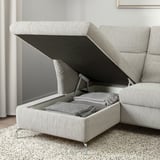 Modern gray fabric sofa with storage. Supports adjustable headrests. Provides covert storage beneath the seat.