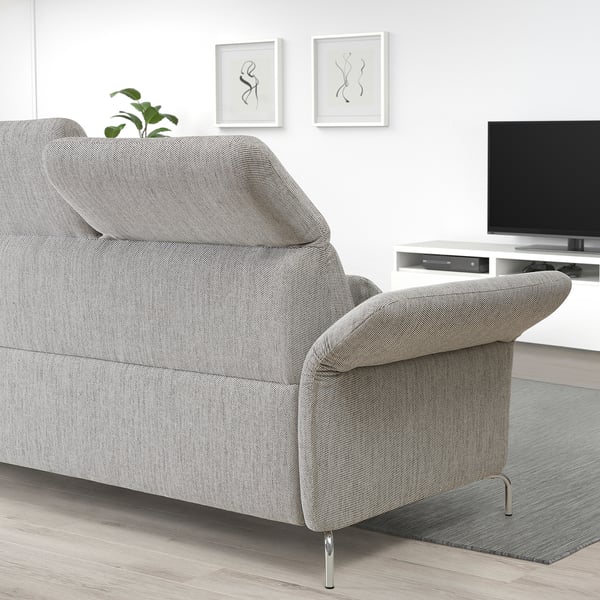 Modern gray FAMMARP sofa with adjustable headrests in minimalist living room.