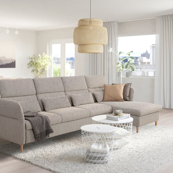 Modern living room with gray FAMMARP sofa, woven pendant lamp, and white coffee tables, creating a cozy atmosphere.