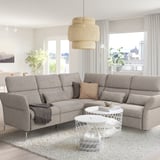 Modern living room: gray FAMMARP sectional, rug, pendant light, white coffee table, large windows with curtains.