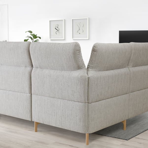 Light gray FAMMARP sectional sofa, modern design with adjustable headrests and wooden legs in a spacious room.