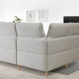 Light gray FAMMARP sectional sofa, modern design with adjustable headrests and wooden legs in a spacious room.