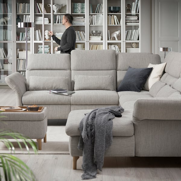 A modern living room with a FAMMARP sectional & bookcase.