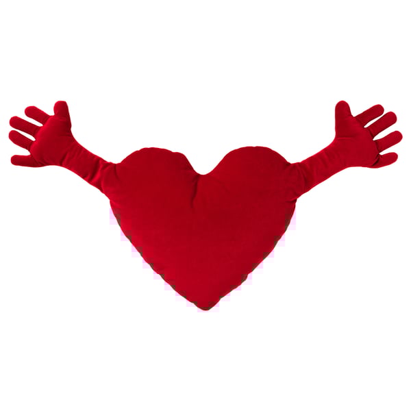 Red heart-shaped pillow with arms outstretched, made of soft fabric.