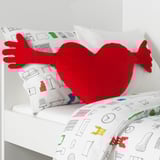 Red heart pillow, white blanket arm pattern.
