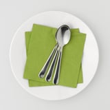 A plate with green paper napkins and three metal spoons. Napkins are absorbent and decorative for table settings.