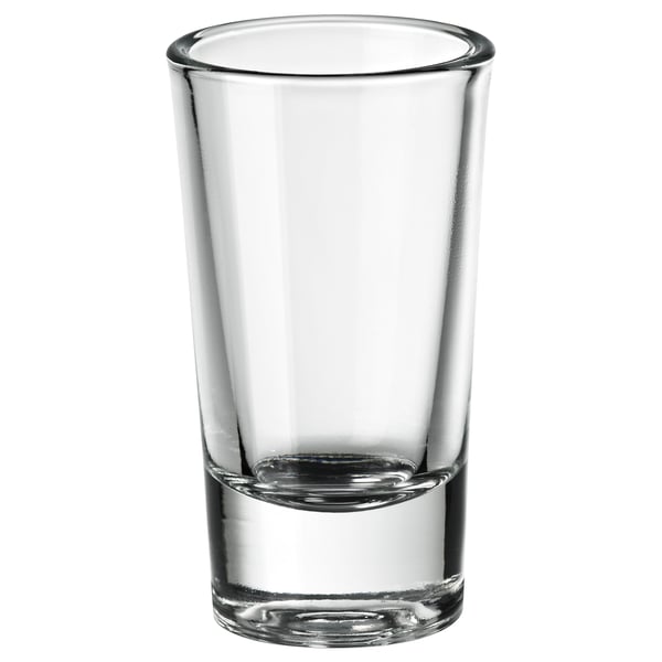 FIGURERA shot glass. Clear, transparent, cylindrical with wide base. Simple, sleek design. Made from glass. Perfect for spirits.