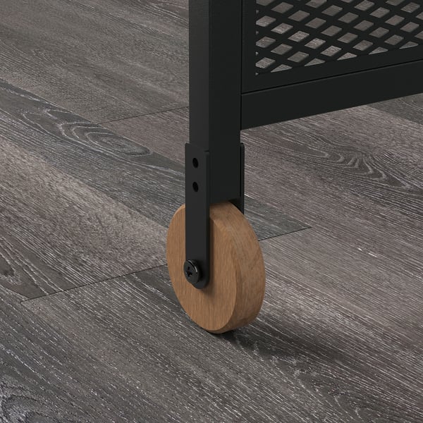 Desk leg with wheel on floor.