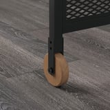 Desk leg with wheel on floor.