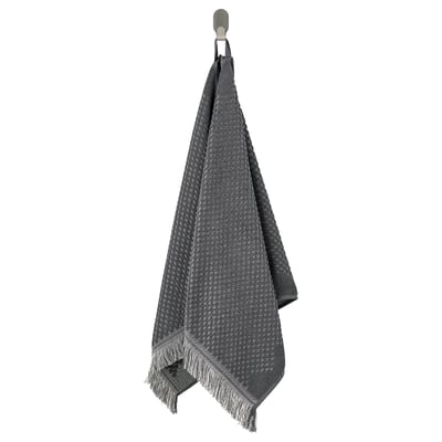 Grey FJÄLLSTARR cotton towel with intricate texture and fringe.