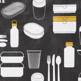 A collection of various lunch items, showcasing quality containers, utensils, and bottles, displayed neatly on a textured black surface.