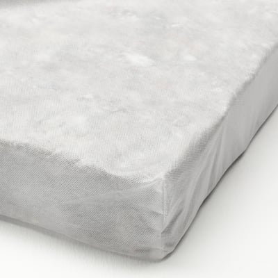 White cushioned mattress topper, neatly rolled, showing soft, supportive material.