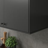 Kitchen cabinet with light, plant, grinder below