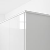 White glossy cabinet trim, likely used to hide lighting or as a decorative top molding.