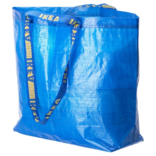 Ikeas blue FRAKTA bag with yellow straps, rectangular, durable, reusable shopping bag.