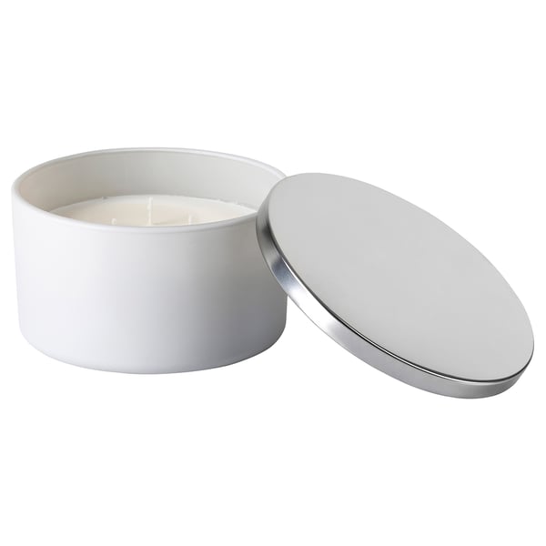 White metal lidded candle jar with cotton wick. Modern, minimalist design.