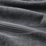 Close-up of soft, thick, gray FREDRIKSJÖN cotton towel with intricate weave pattern.