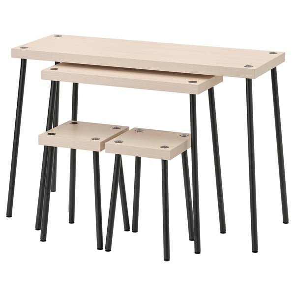 Set of 2 light beige nesting tables and stools with black metal legs. Modern, minimalist design with smooth surfaces and angled legs for stability.