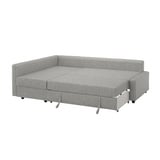 Gray convertible sofa-bed with fabric upholstery, offering versatile seating and sleeping options.