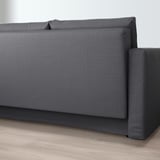 Modern grey convertible sofa bed with built-in storage. Ideal for multi-use rooms, offering practical space-saving solution.