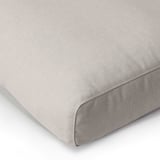 Soft, grey cushioned chair corner, comfy and stylish with removable, washable cover.