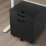Black mobile filing cabinet on wheels with lock, ideal for offices.