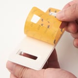 Hand holding wall hooks organizer