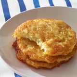 Stack of golden-brown potato pancakes on a white plate, crispy outside, soft inside.
