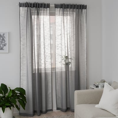 Gje shear curtains in gray, allowing light with privacy. Modern, recycled polyester design.