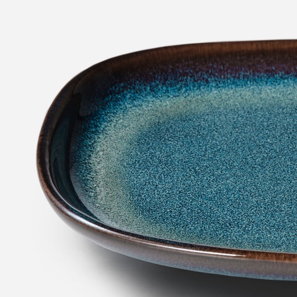 Blue plate with gold edge.