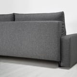 A gray fabric sofa-bed with storage under the seat.