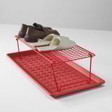 Red foldable shoe rack holds three pairs. Ideal for hallways and closets.