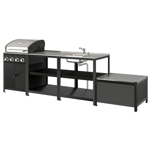 Black ikea GRILLSKÄR outdoor kitchen. Includes grill, sink, storage, and bench. Modern, stainless steel accents.