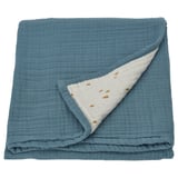 A blue GULDVÄVARE baby blanket with a white patterned side, folded. Made of organic cotton muslin.