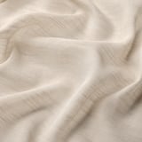 Sheer beige curtains, smooth texture, light filtering, quality fabric.