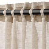 Curtains with heading tape for easy rod or track mounting, creating neat pleats and allowing light through for privacy.