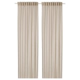 Light beige sheer HÄLLEBRÄCKA curtains, folded in two panels, hang vertically, made from recycled polyester.