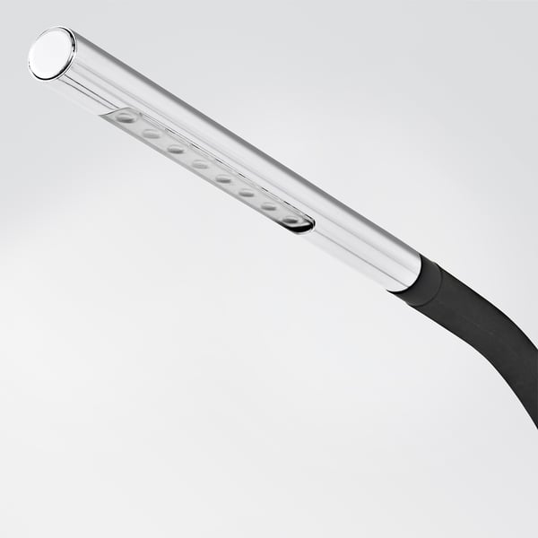 Silver and black desk lamp with adjustable neck and multiple led bulbs. Minimalist and modern design for efficient lighting.