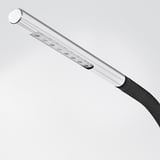 Silver and black desk lamp with adjustable neck and multiple led bulbs. Minimalist and modern design for efficient lighting.