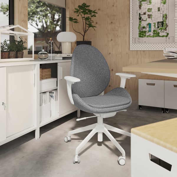 Modern gray office chair with white base, armrests, and ergonomic design, positioned in a stylish workspace.